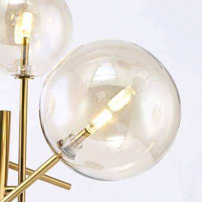 Candeeiro de pé LED dourado com ramos e bolas de vidro giradas